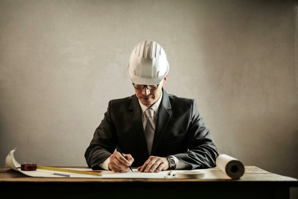 Man planning project wearing construction cap