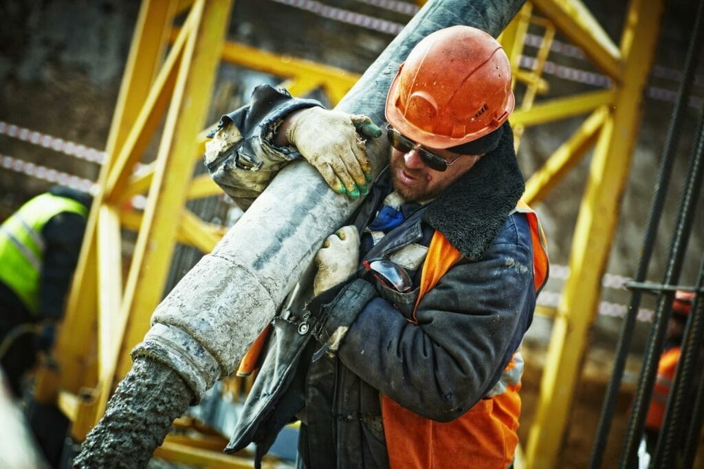 Construction worker holding his equipment